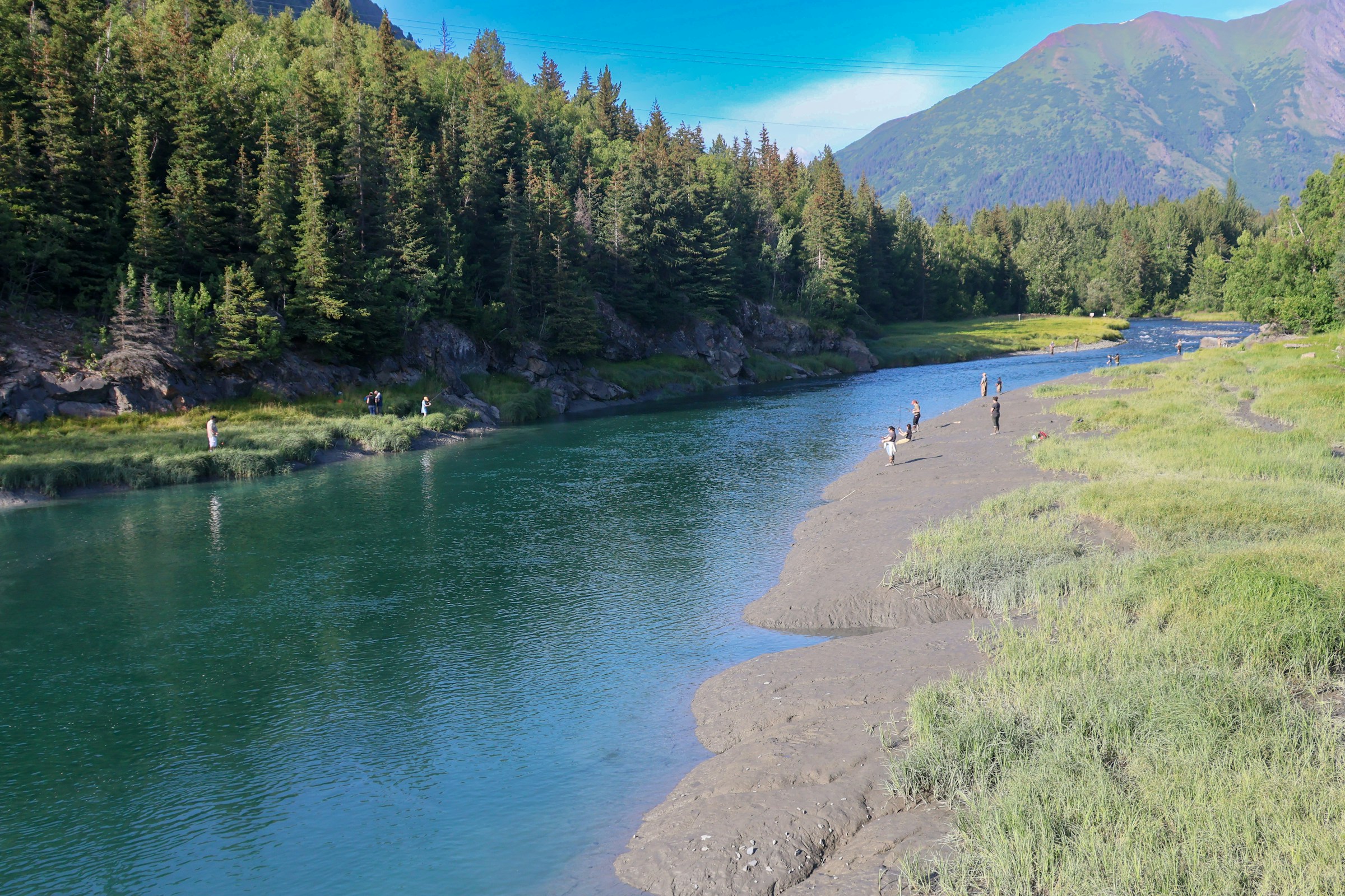 The turquoise Kenai River surrounded by Alaska forest